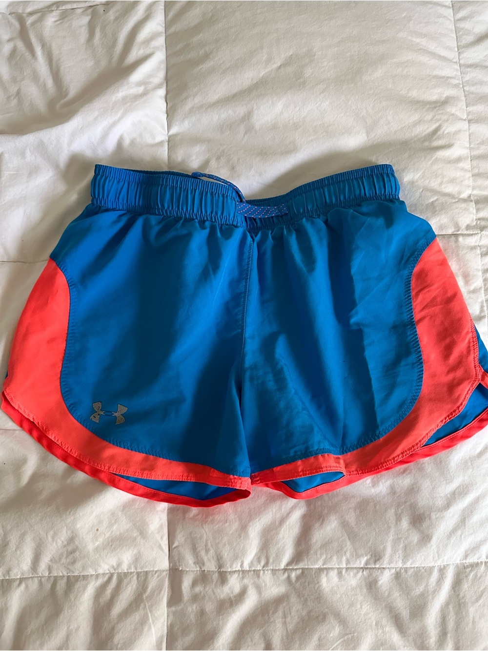 Neon blue and orange running shorts